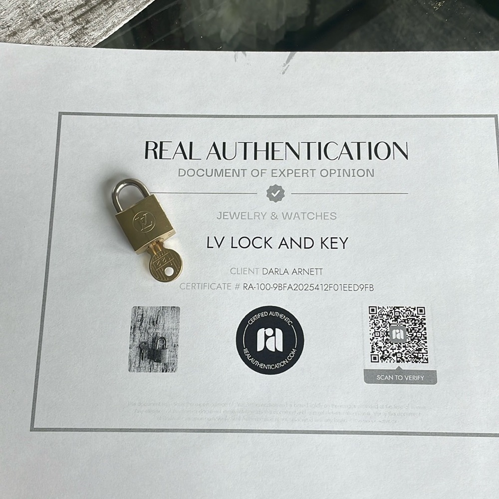 RARE authentic 122 silver and gold lock and key. With box and dust bag.